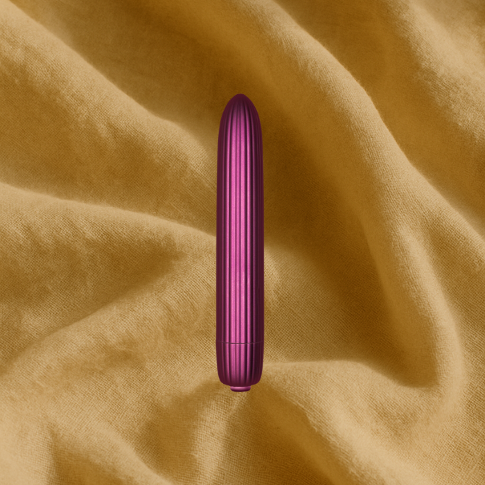 A magenta bullet on a linen background